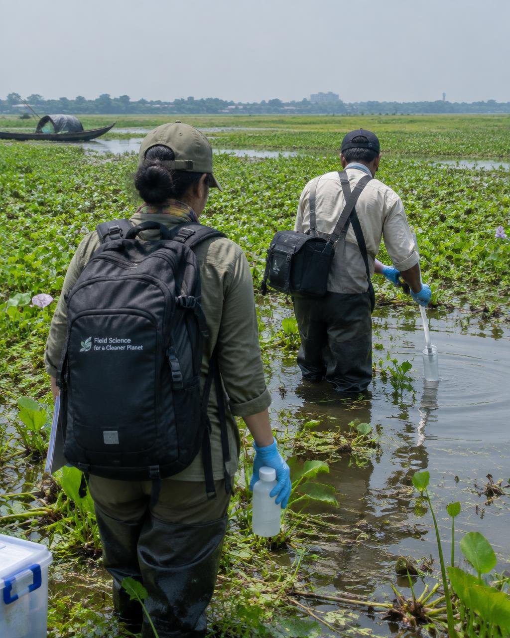 Field scientists collecting water samples